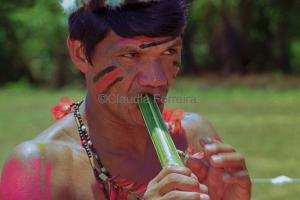 Man Playing A Bamboo Flute