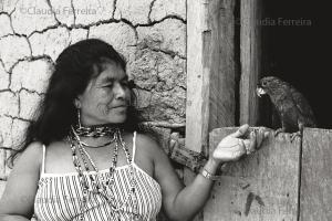 Indigenous Woman  Smiles At Her Parrot