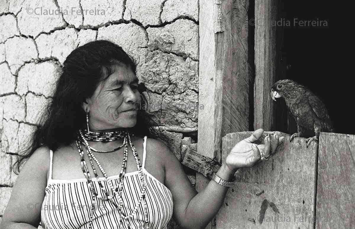 Indigenous Woman  Smiles At Her Parrot